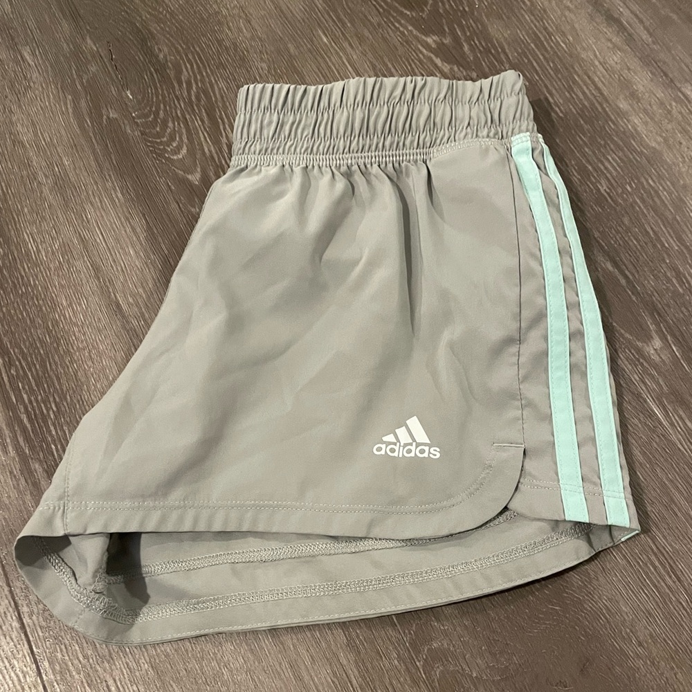 Grey and turquoise adidas women shorts.